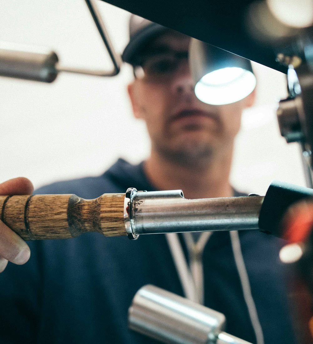 Master plumber working precisely with hand tools — the standard of craft on every PlumbersOttawa.ca job.