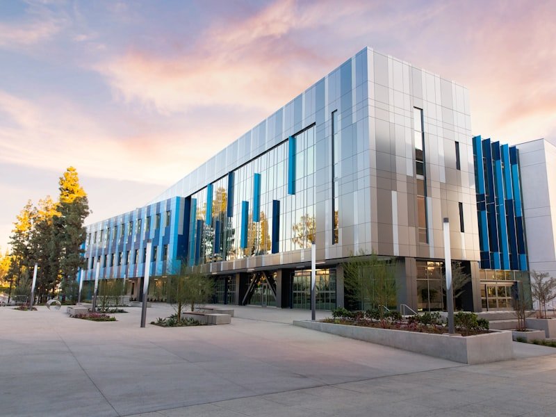 Modern commercial building exterior — commercial plumbing and property-management contracts.