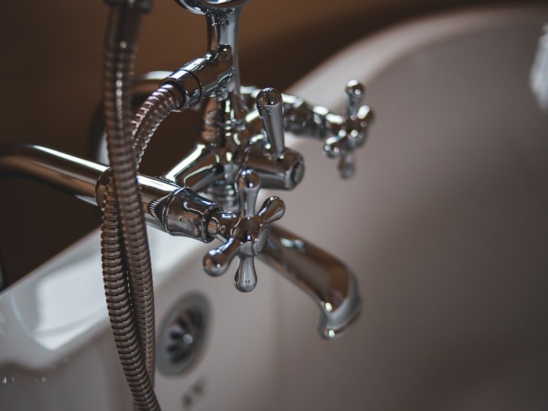 Chrome bathtub fixtures — pipe leak detection and whole-house repiping.